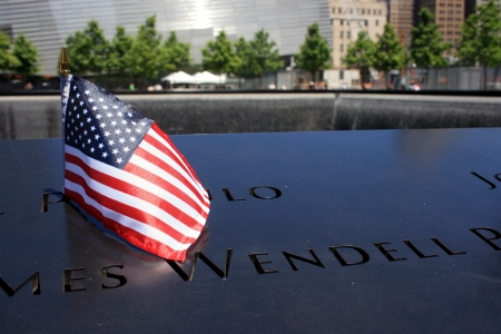 New York City, USA - May 19, 2012 - Flag left at the National 9/11 Memorial at Ground Zero.のeditorial素材