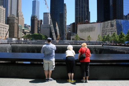 New York City, USA - May 19, 2012 - Family gathered at the National 9/11 Memorial at Ground Zero.のeditorial素材