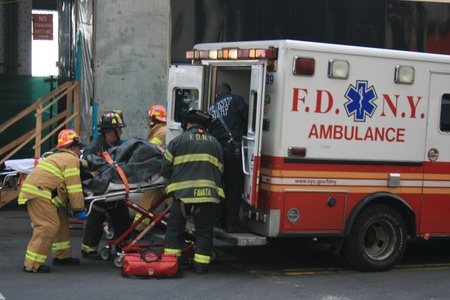 New York City, USA - January 9, 2013 - Injured person being put into an ambulance following a ferry accident.のeditorial素材