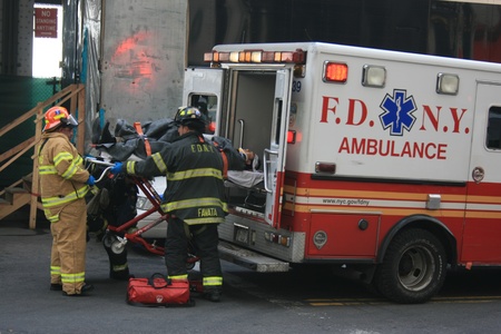 New York City, USA - January 9, 2013 - Injured person being put into an ambulance by the FDNY following a ferry accident.のeditorial素材