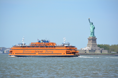 New York City, USA - May 26, 2014 - Staten Island Ferry passing the Statue of Liberty のeditorial素材