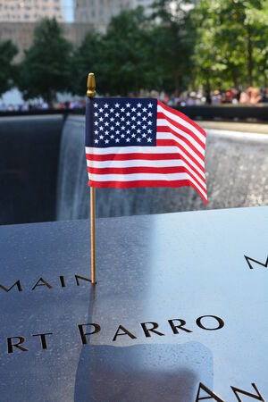 New York City, USA - August 10, 2014 - Flag left at the National 9 11 Memorial at Ground Zero のeditorial素材