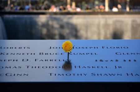 New York City, USA - November 12, 2014 - Flower left at the National 9/11 Memorial at Ground Zero in honor of veterans day.のeditorial素材