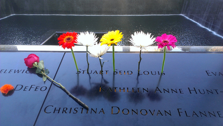 New York City September 12 2015 - Flowers left at the National 911 Memorial marking the anniversary of the attacks at Ground Zero.のeditorial素材
