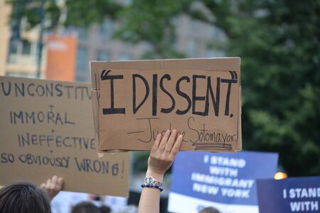 NEW YORK CITY  - JUNE 26, 2018: Protests against the Supreme Court's decision to uphold President Trump's Muslim Travel Ban.のeditorial素材