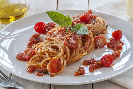 Tomato pasta with basil, cherry tomatoes and parmesan cheeseの写真素材