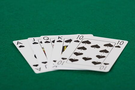 Winner poker hand at a game table. Shallow depth of field
