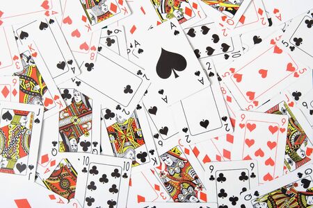 Scattered deck of playing cards on a tableのeditorial素材
