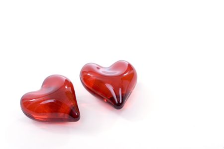 Small gummy hearts isolated over white background. Shallow depth of field.の写真素材