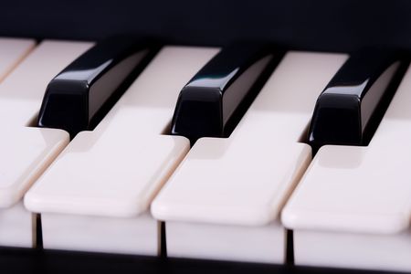 Partial view of a piano keyboard. Macro shot. Shallow depth of field.の写真素材