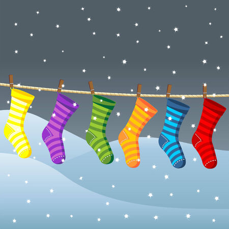 Clothes line for Christmas socks over snow fieldのイラスト素材