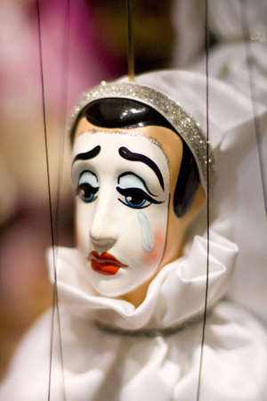 A sad puppet in a shallow depth of field.の写真素材