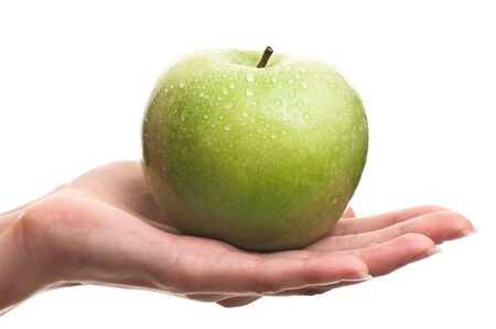holding green appleの写真素材