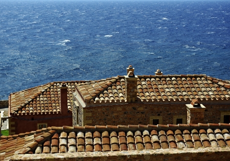 Monemvasia is a powerful medieval fortress town in Greece located on a small peninsula off the east coast of the Peloponnese linked to the mainland by a short causeway  The town walls and many Byzantine churches remain from the mediaeval period の写真素材