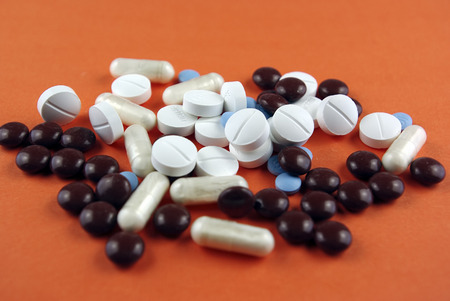 Pills, medicals, drugs, tablets in different colors, unpacked.