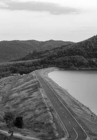 black and white of dam and the road in front of dam In the mountains.の写真素材