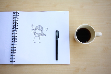 Open a blank white notebook, pen and cup of coffee on the deskのeditorial素材