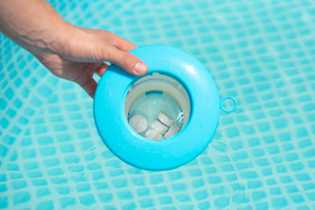 pool chlorine tablets to keep the water of the home pool cleanの写真素材