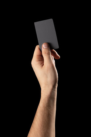 hand hold plastic card. isolated object on blackの写真素材