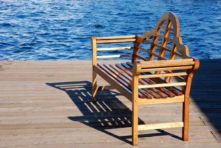 Wooden bench on the pierの写真素材