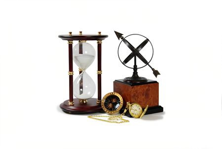 Gold pocket watch with a metal chain, Antique time zone converter used by travellers, Sundial...