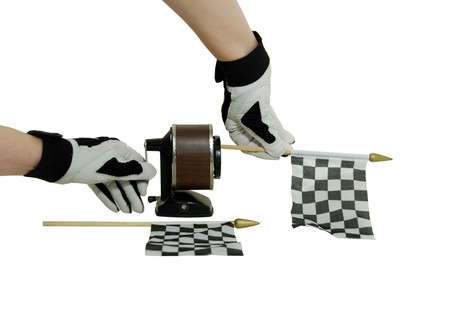 Racing gloves, old school pencil sharpener and racing flagsの写真素材