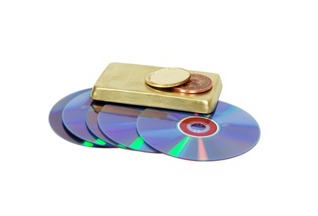 A couple of purple dvds with red interiors, collection of gold coins and bars stamped with symbols of wealthの写真素材