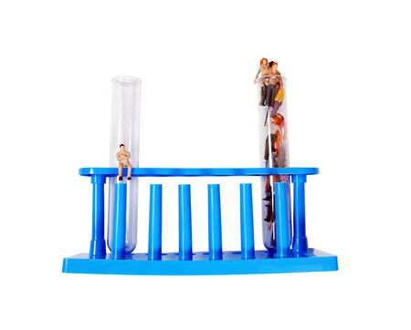 Test tubes for laboratory experiments filled with a variety of peopleの写真素材