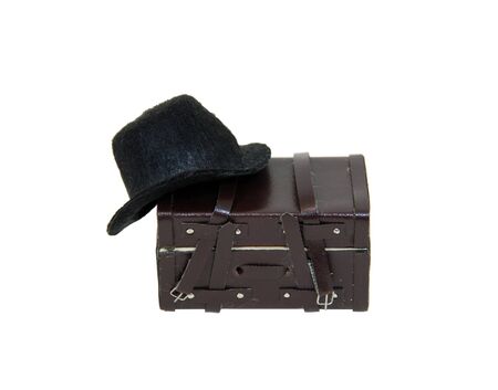 Black hat to be worn on the head for protection and fashion and leather trunk for traveling-Path orig sizeの写真素材