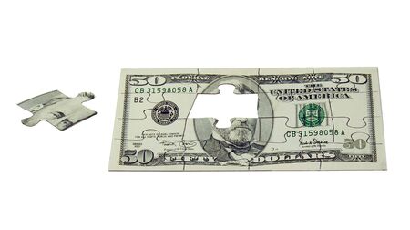 Puzzle pieces interlocked together to make a rectangle forming a large denomination of moneyの写真素材