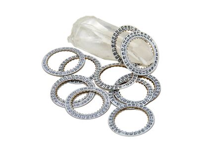 A crystal with many different facets covered with date dials from many watches displays the essence of timeの写真素材