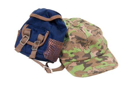 A camouflage baseball hat for everyday wear when you want to blend in with the crowd and a backpack for carrying essentialsの写真素材