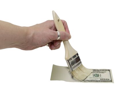 Painting large amount of money onto paper to make a fortuneの写真素材