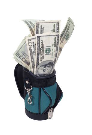 Winning the game shown by a golf bag full of large bills of money の写真素材