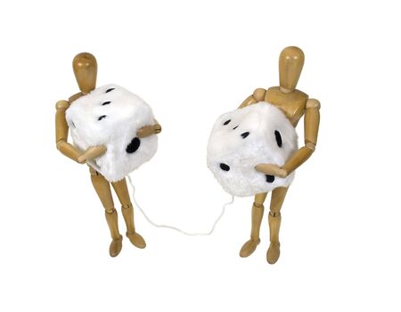 Sharing a car together shown by a couple holding a pair of fuzzy dice that are usually hung from the rear view mirror of a car - path includedの写真素材