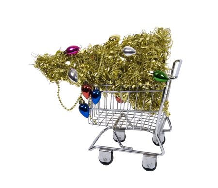 Shopping for the holidays with a golden Christmas tree in a shopping cart - path includedの写真素材