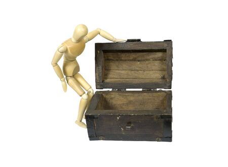 Model looking into an antique wooden chest with metal straps and hardware の写真素材