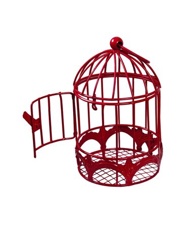 Door open to a birdcage that is used to keep a pet bird comfortable の写真素材