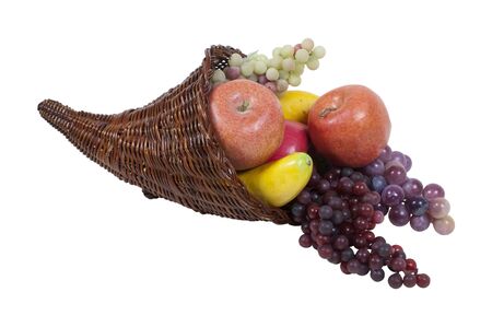 Wicker horn cornucopia full of fruit which is symbolic for plentiful abundance - path included