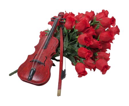 Classical wooden Violin on a bouquet of red roses - path includedの写真素材