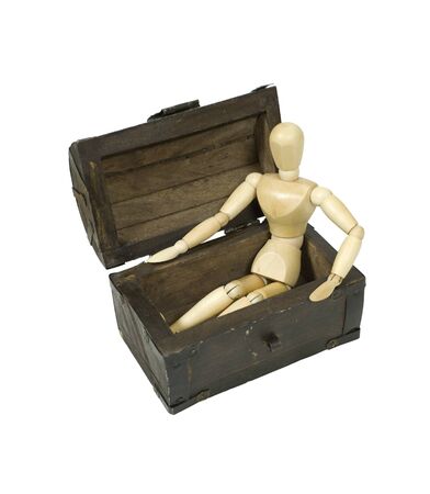 Model sitting in an antique wooden treasure chestの写真素材