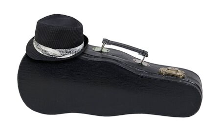 Black fedora on a music case with handle used for carrying and storing musical instruments - path includedの写真素材
