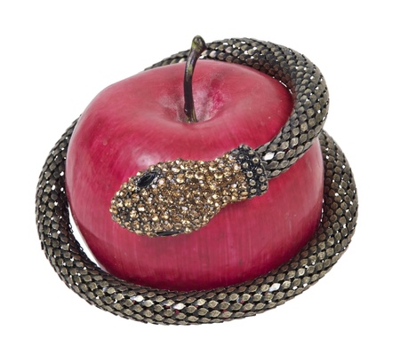 Temptation shown by a gemmed snake wrapped around an appleの写真素材
