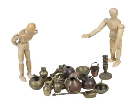 Browsing through a vendors variety of wares at a garage sale 