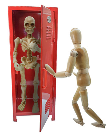 Someone pushing a skeleton into Red school lockerの写真素材