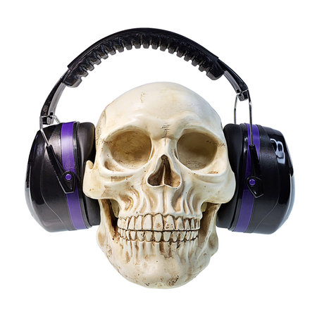 Skull wearing purple Headphones over his headの写真素材