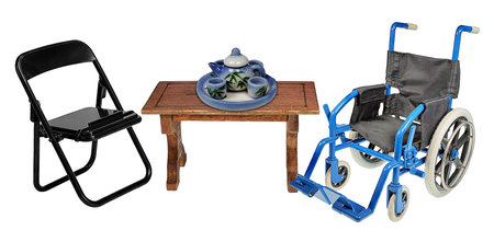 Wheelchair and extra folding chair with a tea set to show spending time with the elderlyの写真素材