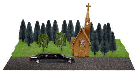 Limousine for travel to special occasions in front of a church with trees nearby