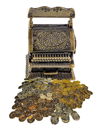 An antique cash register surrounded by gold coinsの写真素材