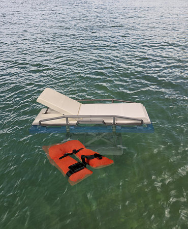 Hospital Bed just staying afloat above the water